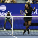 
              Serena Williams, of the United States, returns a shot during her first-round doubles match with Venus Williams, against Lucie Hradecká and Linda Nosková, of the Czech Republic, at the U.S. Open tennis championships, Thursday, Sept. 1, 2022, in New York. ( (AP Photo/Charles Krupa)
            
