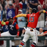 
              Atlanta Braves' Ronald Acuna Jr. (13) and teammates celebrate his two-run home against the Philadelphia Phillies during the eighth inning of a baseball game Friday, Sept. 16, 2022, in Atlanta. (AP Photo/John Bazemore)
            