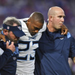 
              Tennessee Titans running back Trenton Cannon (23) is helped off the field after being hurt during the first half of an NFL football game against the Buffalo Bills, Monday, Sept. 19, 2022, in Orchard Park, N.Y. (AP Photo/Adrian Kraus)
            