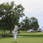 
              Jeongeun Lee, of South Korea, drives from the 14th tee during the third round of the LPGA Tour Kroger Queen City Championship golf tournament in Cincinnati, Saturday, Sept. 10, 2022. (AP Photo/Aaron Doster)
            