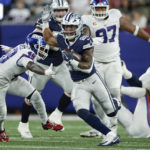 
              New York Giants safety Julian Love (20) runs the ball against New York Giants linebacker Tae Crowder (48) during the second quarter of an NFL football game, Monday, Sept. 26, 2022, in East Rutherford, N.J. (AP Photo/Adam Hunger)
            