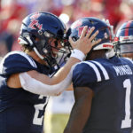 
              Mississippi quarterback Jaxson Dart (2) and wide receiver Jonathan Mingo (1) react after a touchdown catch by Mingo during the first half of an NCAA college football game against Tulsa in Oxford, Miss., Saturday, Sept. 24, 2022. (AP Photo/Thomas Graning)
            
