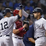
              New York Yankees' Isiah Kiner-Falefa (12) celebrates with Marwin Gonzalez, right, after Gonzalez hit a two-run home run against the Boston Red Sox during the third inning of a baseball game Tuesday, Sept. 13, 2022, in Boston. Red Sox's Reese McGuire is at rear. (AP Photo/Steven Senne)
            