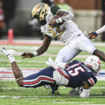 
              UAB's Jalen Mayala, top, is tackled by Liberty's Brylan Green during an NCAA college football game Saturday, Sept. 10, 2022, in Lynchburg, Va. (Paige Dingler/The News & Advance via AP)
            