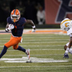 
              Illinois wide receiver Isaiah Williams turns the corner on Chattanooga defensive back Cardavion Myers and heads to the end zone for a touchdown during the second half of an NCAA college football game Thursday, Sept. 22, 2022, in Champaign, Ill. (AP Photo/Charles Rex Arbogast)
            