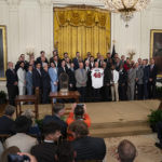 
              President Joe Biden poses for photographs during an event celebrating the 2021 World Series champion Atlanta Braves, in the East Room of the White House, Monday, Sept. 26, 2022, in Washington. (AP Photo/Evan Vucci)
            