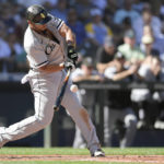 
              Chicago White Sox's Jose Abreu hits an RBI single against the Seattle Mariners during the sixth inning of a baseball game Wednesday, Sept. 7, 2022, in Seattle. (AP Photo/Caean Couto)
            