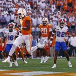 
              Tennessee quarterback Hendon Hooker (5) leaps over the goal line for a touchdown during the first half of an NCAA college football game against Florida, Saturday, Sept. 24, 2022, in Knoxville, Tenn. (AP Photo/Wade Payne)
            