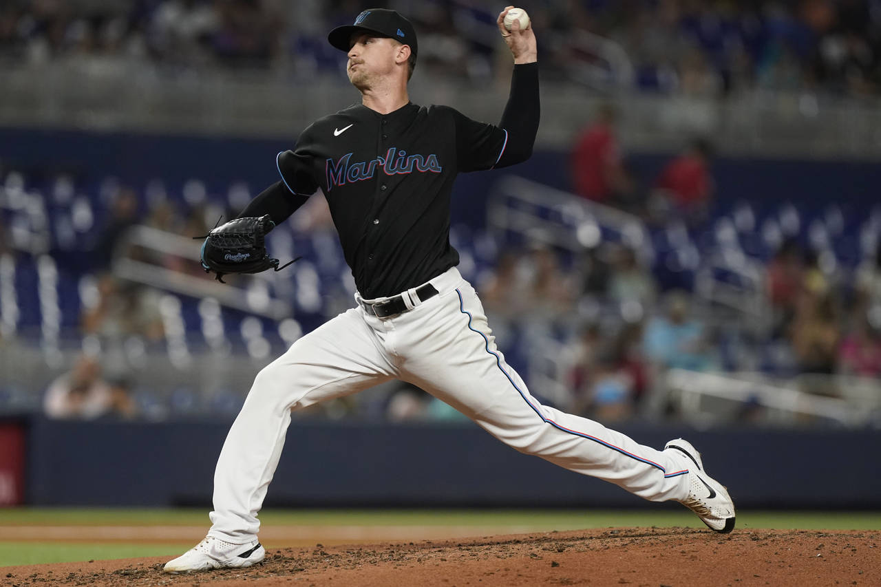 Miami Marlins starting pitcher Braxton Garrett aims a pitch during the third inning of a baseball g...