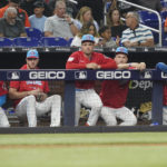 
              Miami Marlins players look on from the dugout as they fall behind the New York Mets during a baseball game, Saturday, Sept. 10, 2022, in Miami. (AP Photo/Marta Lavandier)
            