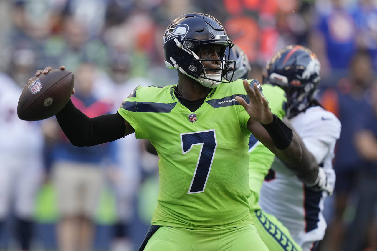 Seattle Seahawks quarterback Geno Smith passes against the Denver Broncos during the first half of ...