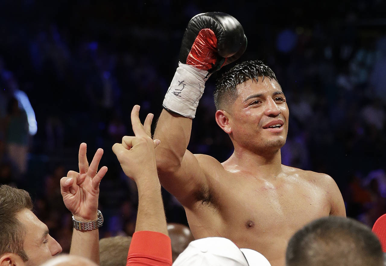 FILE - Abner Mares reacts after winning by technical knockout over Daniel Ponce De Leon in the nint...