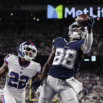 
              Dallas Cowboys wide receiver CeeDee Lamb (88) makes a catch in the end zone for a touchdown against New York Giants cornerback Adoree' Jackson (22) during the fourth quarter of an NFL football game, Monday, Sept. 26, 2022, in East Rutherford, N.J. (AP Photo/Adam Hunger)
            