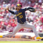 
              Milwaukee Brewers starting pitcher Freddy Peralta (51) throws during the first inning of a baseball game against the Cincinnati Reds, Sunday, Sept. 25, 2022, in Cincinnati. (AP Photo/Jeff Dean)
            