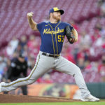 
              Milwaukee Brewers starting pitcher Brandon Woodruff throws during the first inning of the team's baseball game against the Cincinnati Reds on Thursday, Sept. 22, 2022, in Cincinnati. (AP Photo/Jeff Dean)
            