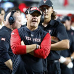 
              Texas Tech head coach Joey McGuire watches a replay during the first half of an NCAA college football game against North Carolina State in Raleigh, N.C., Saturday, Sept. 17, 2022. (AP Photo/Karl B DeBlaker)
            