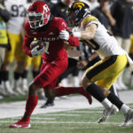 
              Rutgers wide receiver Shameen Jones (7) rushes for a first down against Iowa defensive back Quinn Schulte (30) during the second half of an NCAA college football game, Saturday, Sept. 24, 2022, in Piscataway, N.J. (AP Photo/Noah K. Murray)
            