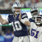 
              Dallas Cowboys quarterback Cooper Rush (10) passes against the New York Giants during the second quarter of an NFL football game, Monday, Sept. 26, 2022, in East Rutherford, N.J. (AP Photo/Adam Hunger)
            