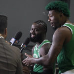 
              Boston Celtics basketball guards Jaylen Brown, center, and Marcus Smart, right, speak with a reporter during the NBA basketball team's Media Day, Monday, Sept. 26, 2022, in Canton, Mass. (AP Photo/Steven Senne)
            
