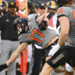 
              Oklahoma State fullback Braden Cassity (90) watches as wide receiver John Paul Richardson (17) reaches for a first down during the first quarter of an NCAA college football game against Arkansas-Pine Bluff, Saturday, Sept. 17, 2022, in Stillwater, Okla. (AP Photo/Brody Schmidt)
            