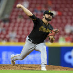 
              Pittsburgh Pirates' Bryse Wilson throws during the second inning of a baseball game against the Cincinnati Reds in Cincinnati, Monday, Sept. 12, 2022. (AP Photo/Aaron Doster)
            