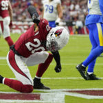 
              Arizona Cardinals cornerback Marco Wilson (20) reacts after breaking up a pass attempt by the Los Angeles Rams during the first half of an NFL football game, Sunday, Sept. 25, 2022, in Glendale, Ariz. (AP Photo/Ross D. Franklin)
            