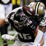 
              New Orleans Saints safety Justin Evans (30) breaks a pass intended for Atlanta Falcons tight end Parker Hesse (46) during the second half of an NFL football game, Sunday, Sept. 11, 2022, in Atlanta. (AP Photo/John Bazemore)
            