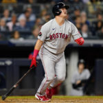 
              Boston Red Sox's Reese McGuire follows through on a three-run home run during the seventh inning of a baseball game against the New York Yankees Thursday, Sept. 22, 2022, in New York. (AP Photo/Frank Franklin II)
            