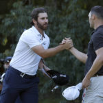 
              Matthew Wolff, left, shakes hands with Martin Kaymer after they finished the first round of the LIV Golf Invitational-Boston tournament, Friday, Sept. 2, 2022, in Bolton, Mass. (AP Photo/Mary Schwalm)
            