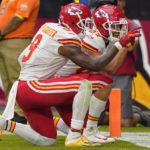 
              Kansas City Chiefs tight end Travis Kelce (87) and wide receiver JuJu Smith-Schuster (9) celebrate Kelce's touchdown against the Arizona Cardinals during the first half of an NFL football game, Sunday, Sept. 11, 2022, in Glendale, Ariz. (AP Photo/Matt York)
            