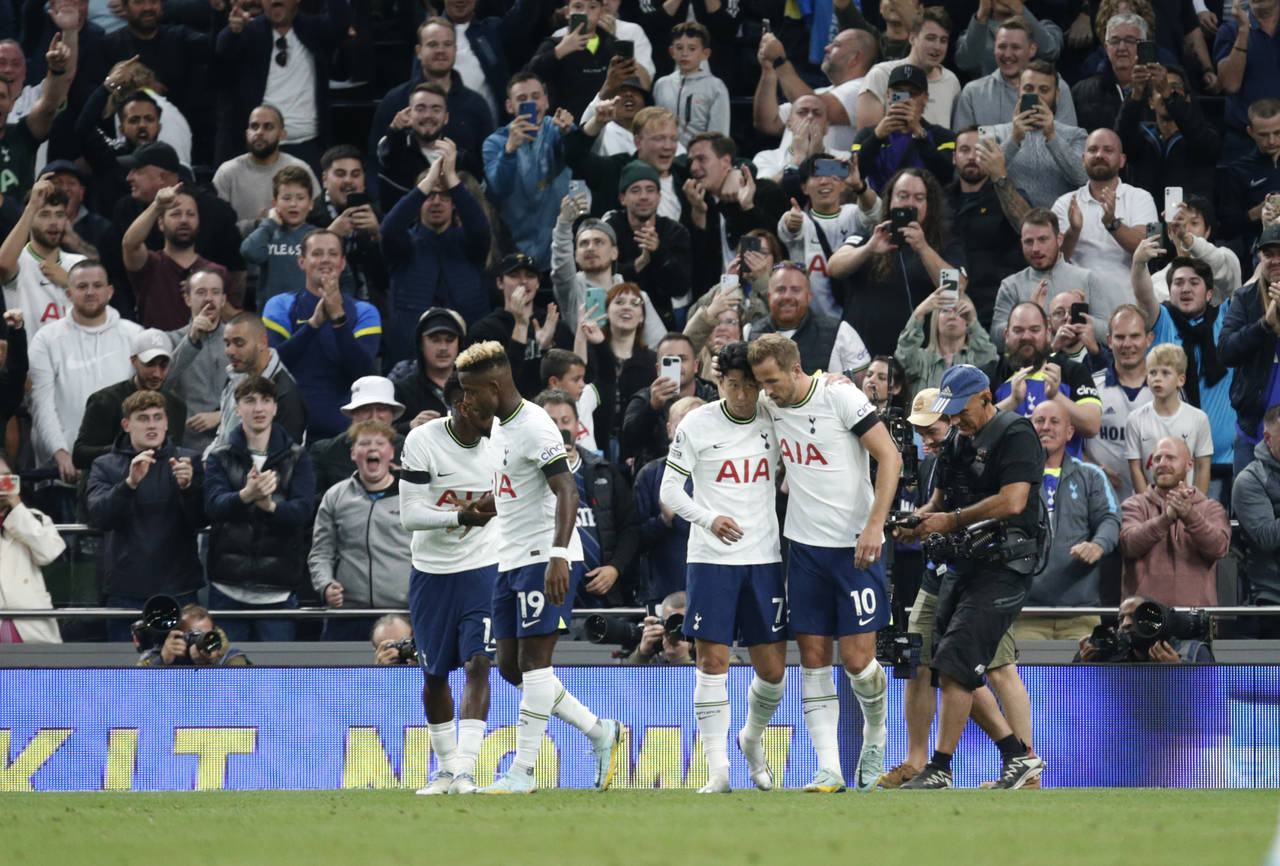 Tottenham's Son Heung-min celebrates with teammates after scoring during the English Premier League...