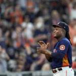 
              Houston Astros starting pitcher Framber Valdez smiles as he is applauded by fans during the seventh inning of a baseball game against the Oakland Athletics after making a Major League Baseball record 25 consecutive quality starts Sunday, Sept. 18, 2022, in Houston. (AP Photo/David J. Phillip)
            