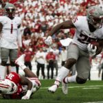 
              Washington State's Nakia Watson (25) runs past Wisconsin's Jake Chaney (36) during the first half of an NCAA college football game Saturday, Sept. 10, 2022, in Madison, Wis. (AP Photo/Morry Gash)
            