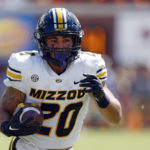 
              Missouri running back Cody Schrader carries the ball against Auburn during the second half of an NCAA college football game, Saturday, Sept. 24, 2022 in Auburn, Ala. (AP Photo/Butch Dill)
            