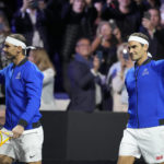 
              Team Europe's Roger Federer, right, and Rafael Nadal wave as they arrive for their Laver Cup doubles match against Team World's Jack Sock and Frances Tiafoe at the O2 arena in London, Friday, Sept. 23, 2022. (AP Photo/Kin Cheung)
            