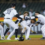 
              Detroit Tigers' Harold Castro, second from right, celebrates hitting the game winning single against the Kansas City Royals in the 10th inning of a baseball game in Detroit, Tuesday, Sept. 27, 2022. (AP Photo/Paul Sancya)
            