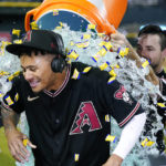 
              Arizona Diamondbacks' Sergio Alcantara gets showered with liquid and bubble gum by Cooper Hummel, right, after his game-ending, three-run home run in the 10th inning against the Los Angeles Dodgers in a baseball game in Phoenix, Wednesday, Sept. 14, 2022. The Diamondbacks won 5-3. (AP Photo/Ross D. Franklin)
            
