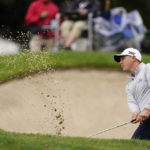 
              Justin Lower hits out of a bunker onto the sixth green of the Silverado Resort North Course during the final round of the Fortinet Championship PGA golf tournament in Napa, Calif., Sunday, Sept. 18, 2022. (AP Photo/Eric Risberg)
            