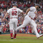 
              St. Louis Cardinals' Albert Pujols, right, is congratulated by first base coach Stubby Clapp (82) after hitting a two-run home run off Chicago Cubs relief pitcher Brandon Hughes, left, during the eighth inning of a baseball game Sunday, Sept. 4, 2022, in St. Louis. (AP Photo/Jeff Roberson)
            
