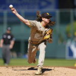 
              San Diego Padres starting pitcher Mike Clevinger delivers a pitch to Colorado Rockies' Yonathan Daza in the first inning of a baseball game Sunday, Sept. 25, 2022, in Denver. (AP Photo/Geneva Heffernan)
            