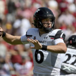 
              Cincinnati quarterback Ben Bryant (6) throws a pass against Arkansas during the first half of an NCAA college football game Saturday, Sept. 3, 2022, in Fayetteville, Ark. (AP Photo/Michael Woods)
            