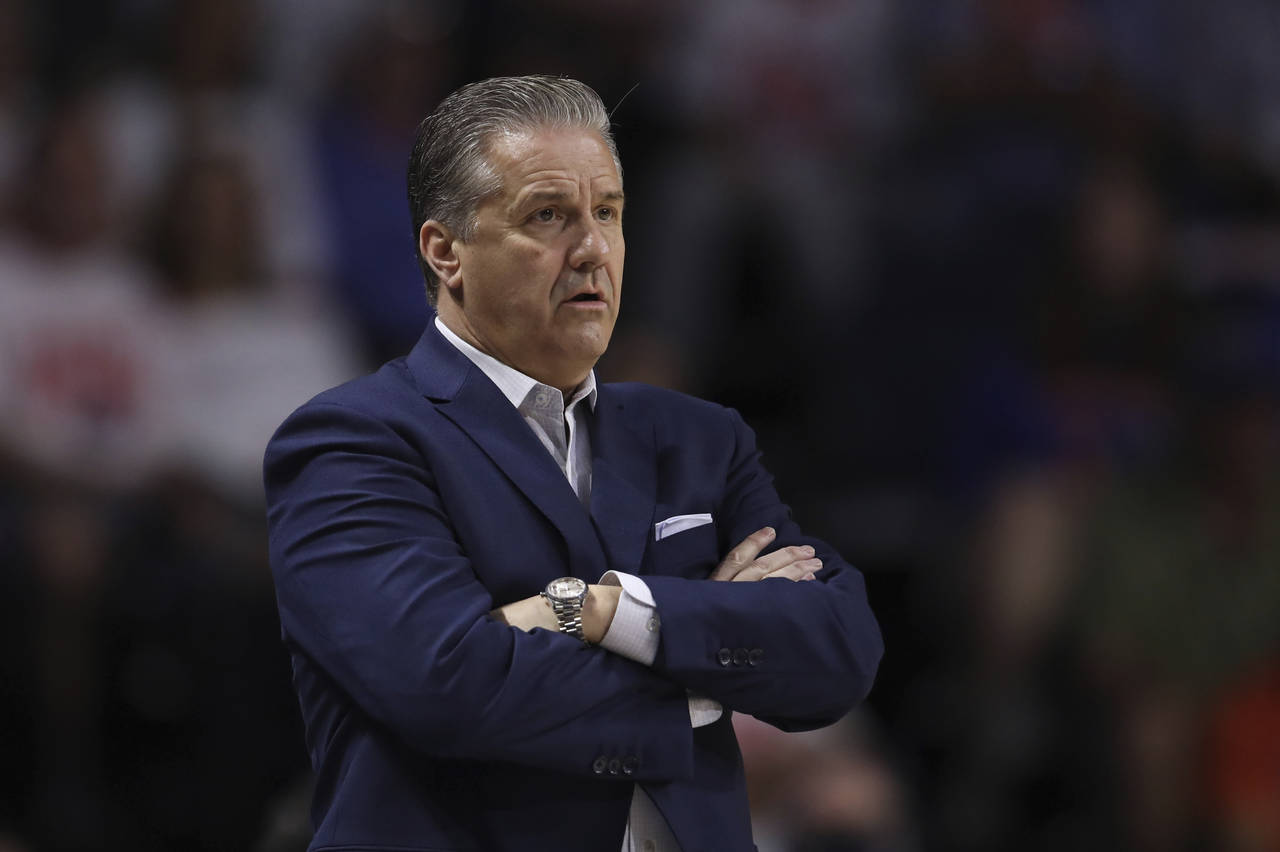 University of Kentucky men’s basketball head coach John Calipari stands on the sidelines during t...