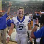 
              Kentucky quarterback Will Levis (7) celebrates in front of fans after Kentucky defeated Florida in an NCAA college football game Saturday, Sept. 10, 2022, in Gainesville, Fla. (AP Photo/John Raoux)
            