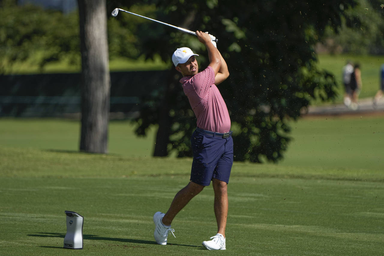 Xander Schauffele hits off the 13th tee during practice for the Presidents Cup golf tournament at t...
