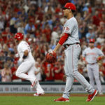 
              Cincinnati Reds relief pitcher Raynel Espinal, foreground, walks back to the mound after giving up a two-run home run to St. Louis Cardinals' Albert Pujols during the sixth inning of a baseball game Friday, Sept. 16, 2022, in St. Louis. (AP Photo/Scott Kane)
            