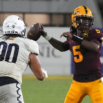 
              Arizona State quarterback Emory Jones (5) looks to pass while being pressured by Northern Arizona defensive lineman Mark Ho Ching during the second half of an NCAA college football game Thursday, Sept. 1, 2022, in Tempe, Ariz. (AP Photo/Rick Scuteri)
            