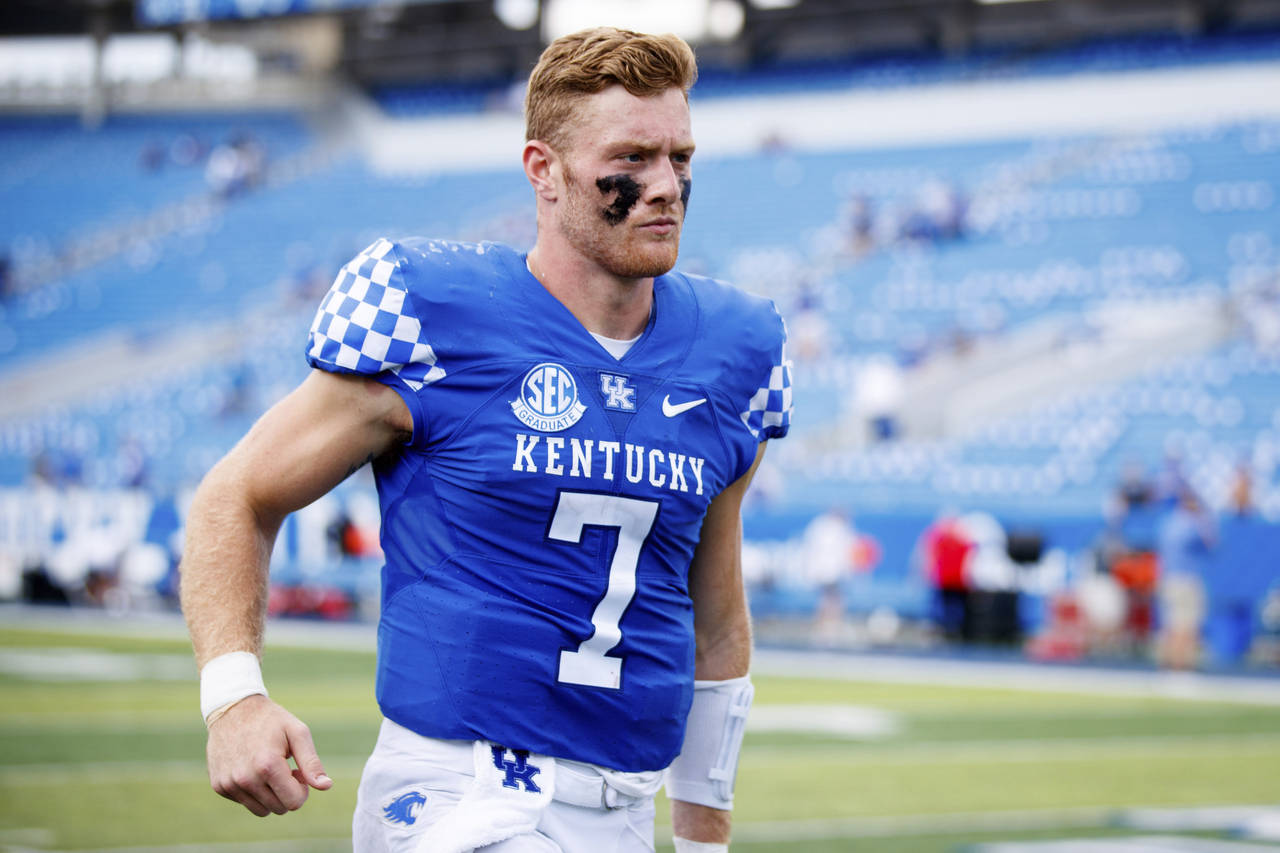 Kentucky quarterback Will Levis runs off the field after an NCAA college football game against Youn...