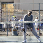 
              Earl Wilson, an inmate at San Quentin State Prison, hits a return during a tennis match against visiting players in San Quentin, Calif., Saturday, Aug. 13, 2022. (AP Photo/Godofredo A. Vásquez)
            