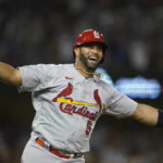 
              St. Louis Cardinals designated hitter Albert Pujols (5) watches after hitting a home run during the fourth inning of a baseball game against the Los Angeles Dodgers in Los Angeles, Friday, Sept. 23, 2022. Brendan Donovan and Tommy Edman also scored. It was Pujols' 700th career home run. (AP Photo/Ashley Landis)
            