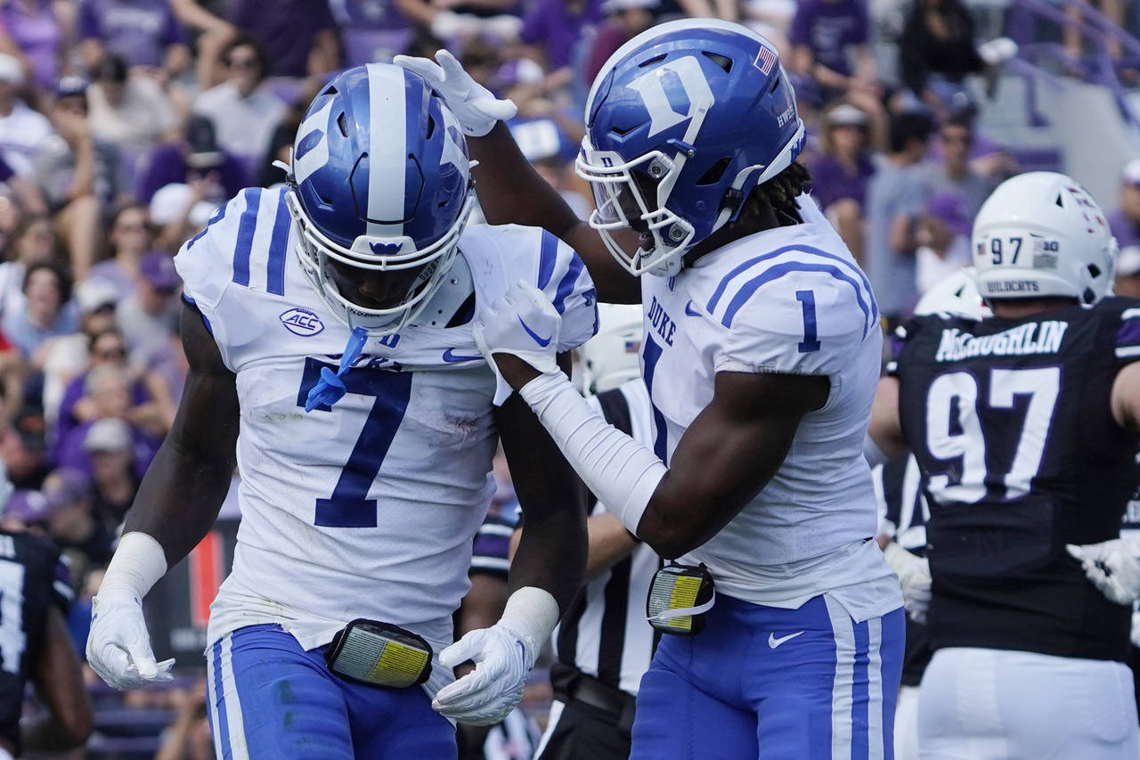 Duke running back Jordan Waters (7) celebrates his touchdown against Northwestern  with wide receiv...